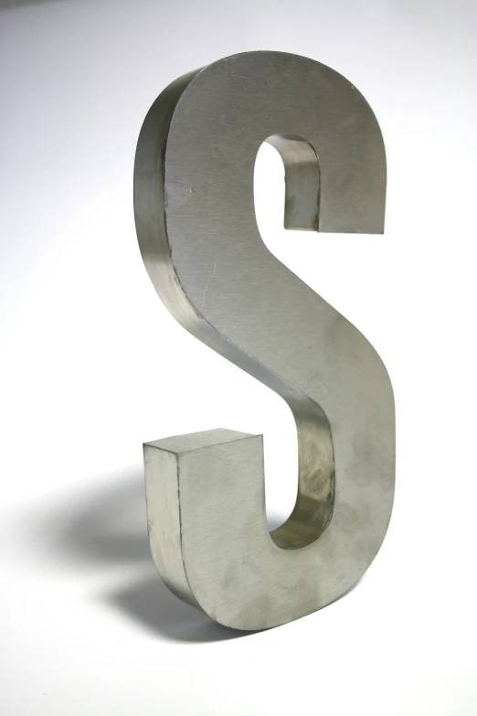 a metal letter s sitting on top of a white surface, by David Simpson, new sculpture, stainless steel, medium, multi-part, grey