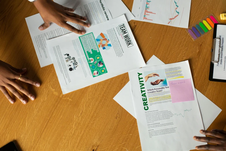 a group of people sitting around a wooden table, on high-quality paper, graphic design, thumbnail, sustainability