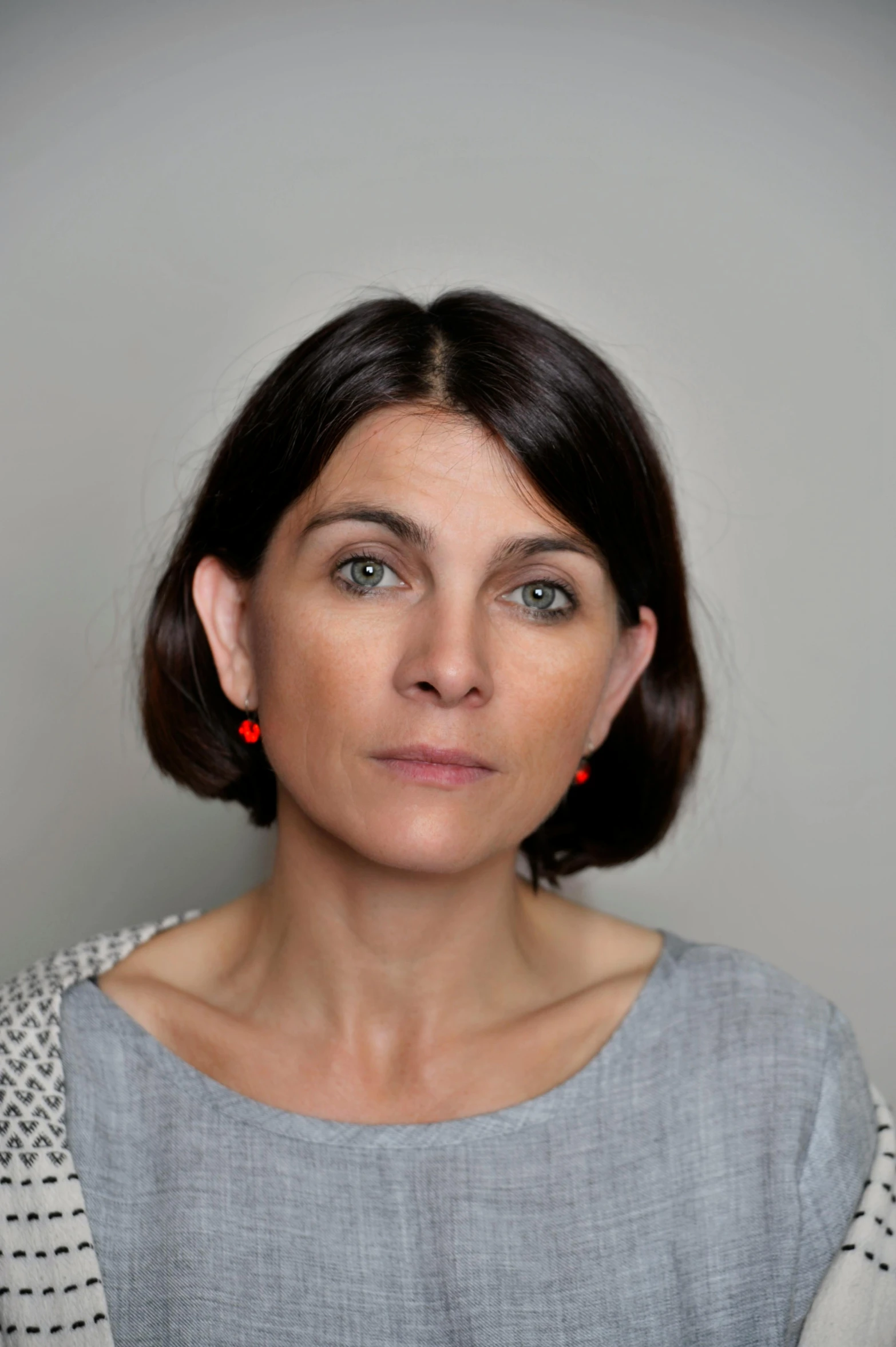 a woman with a serious look on her face, a character portrait, inspired by Cornelia Parker, pexels contest winner, hyperrealism, passport photo, aged 4 0, left ear, mid length portrait photograph