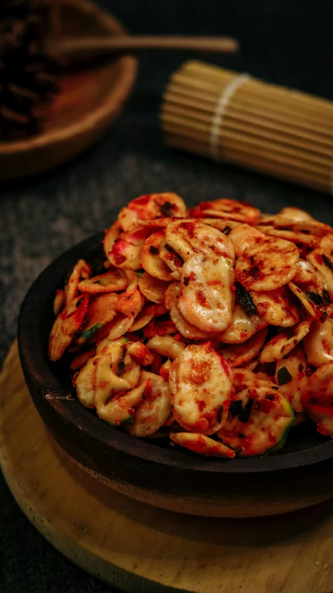 a close up of a plate of food on a table, by Basuki Abdullah, pexels, hurufiyya, spicy, swirles, thumbnail, snacks