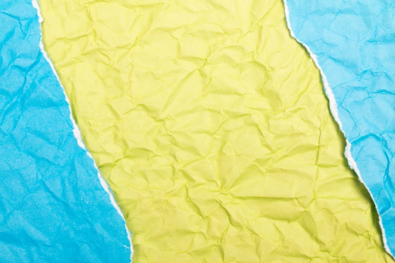 a torn piece of paper on a blue and yellow background, an album cover, inspired by Lynda Benglis, deviantart, closeup, coastline, kevlar, fluorescent skin