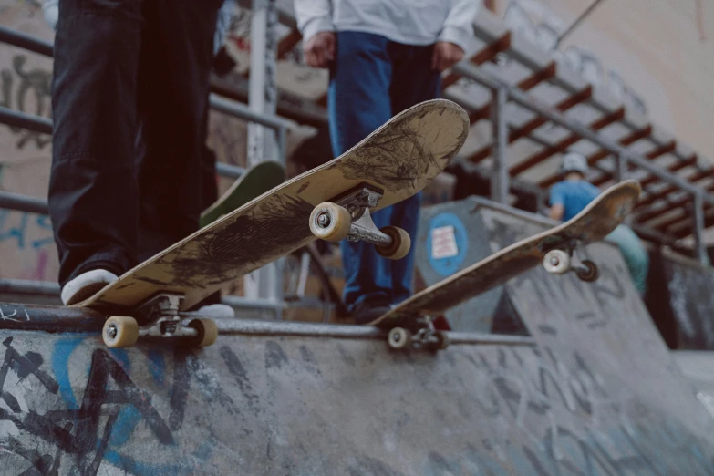 a man riding a skateboard up the side of a ramp, pexels contest winner, male and female, brown, well worn, stacked