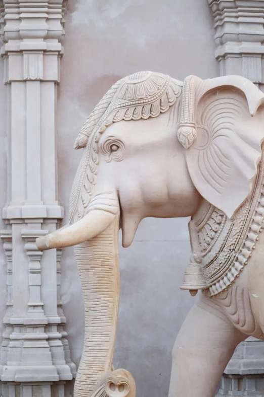 a statue of an elephant and a cat in front of a building, a marble sculpture, inspired by Ram Chandra Shukla, trending on unsplash, art nouveau, silver，ivory, made of marble, detail shot, beige