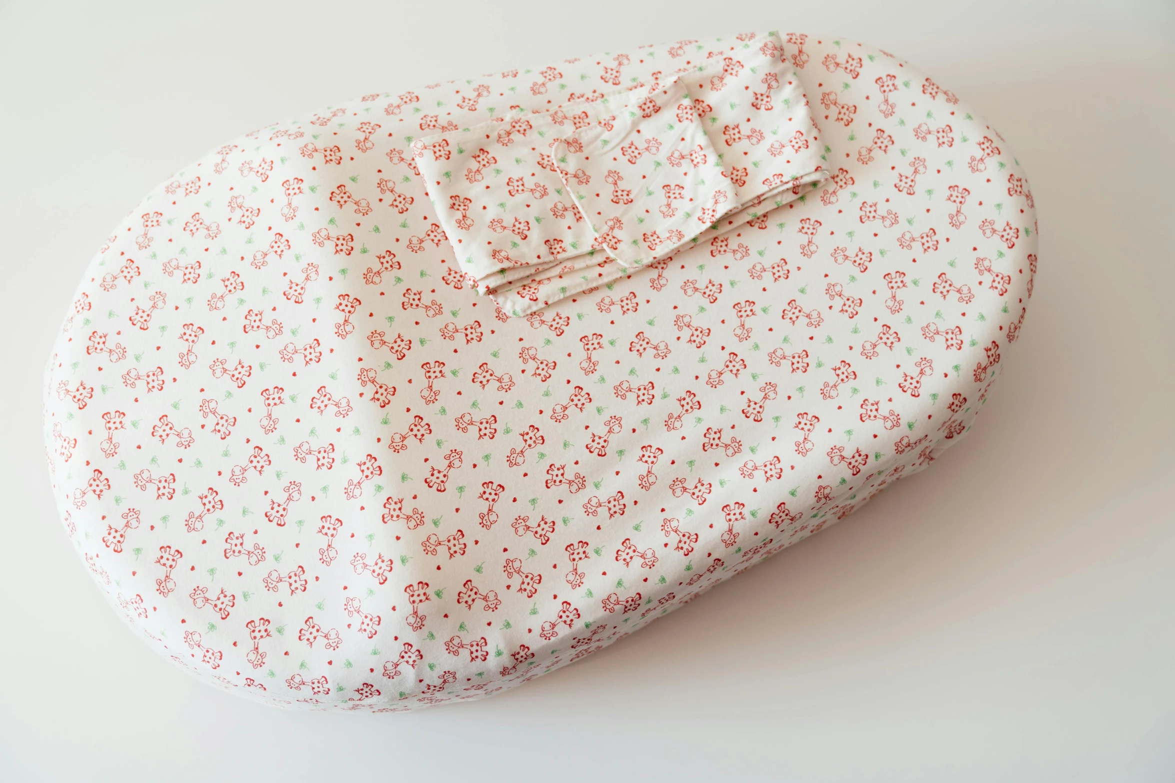 a heart shaped box with a bow on it, inspired by Annabel Kidston, mingei, sleeping bag, viewed from above, delicate patterned, pregnancy