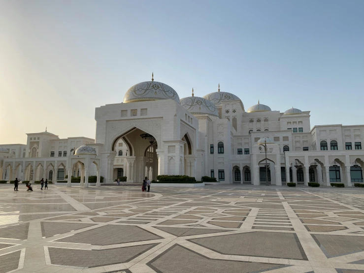 a large white building with a lot of windows, inspired by Frederick Goodall, pexels contest winner, arabesque, arab inspired, domes, early in the morning, deserted