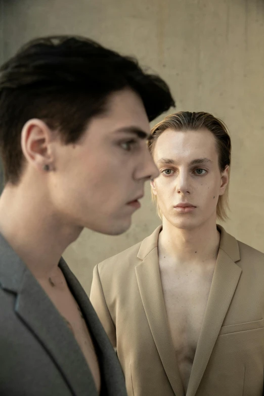 a couple of people standing next to each other, an album cover, trending on pexels, bauhaus, beautiful androgynous prince, looking in mirror, headshot and bodyshot, maxim sukharev