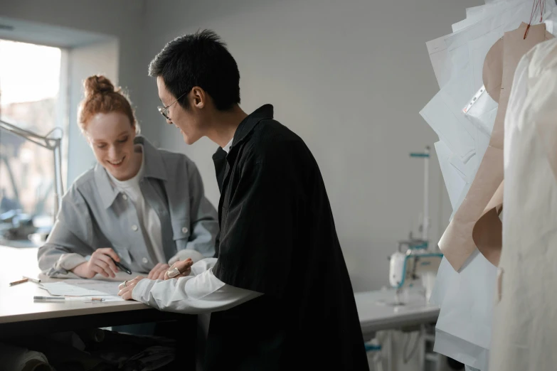 a couple of people that are sitting at a table, trending on pexels, academic art, plastic and fabric, medical drawing, academic clothing, standing in class