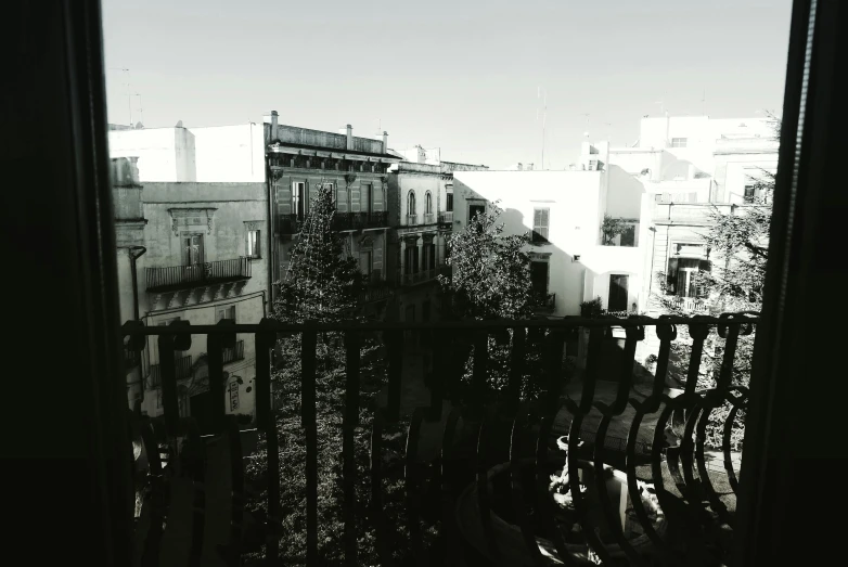 a black and white photo of a balcony, by Altichiero, happening, entire city in view, jerez, sky!!!, square