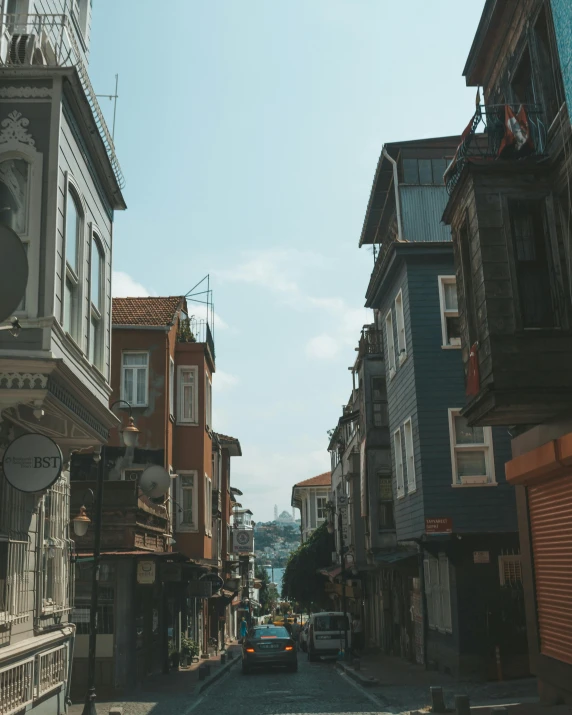 a city street filled with lots of tall buildings, pexels contest winner, turkish and russian, wooden houses, grey, background image
