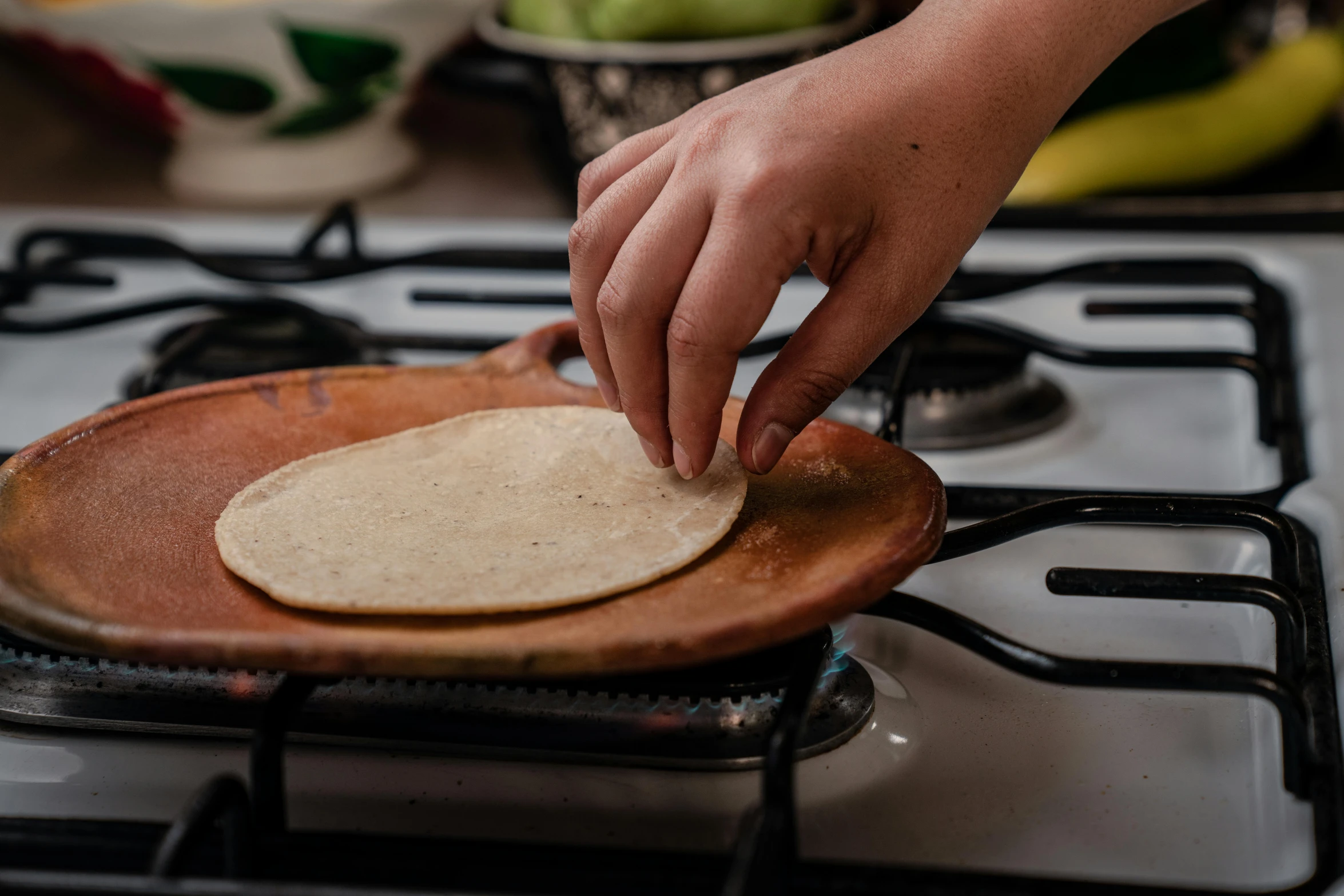 a person putting a tortilla on top of a pan, inspired by Ceferí Olivé, pexels contest winner, mary anning, epicurious, no cropping, thumbnail