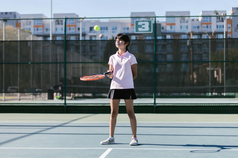 a woman standing on a tennis court holding a racquet, unsplash, girl wearing uniform, louise zhang, sunny day time, profile image