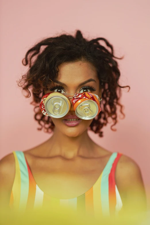 a woman with two cans of soda in front of her face, pexels contest winner, afrofuturism, deep tan skin, circular sunglasses, wide eyed, ashteroth