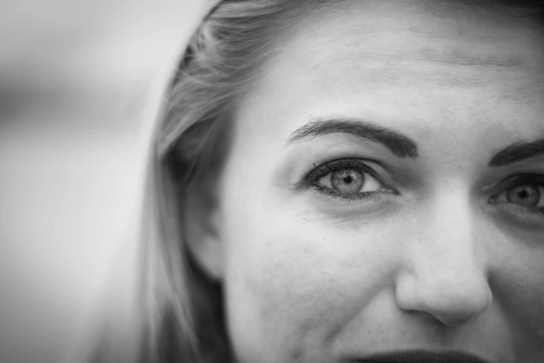 a black and white photo of a woman's face, by Kristian Zahrtmann, pexels contest winner, small eyebrows, young blonde woman, realistic | detailed face, happy smiling human eyes