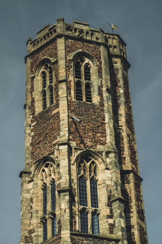 a tall tower with a clock on top of it, an album cover, by IAN SPRIGGS, unsplash, romanesque, delft, deteriorated, top - side view, england