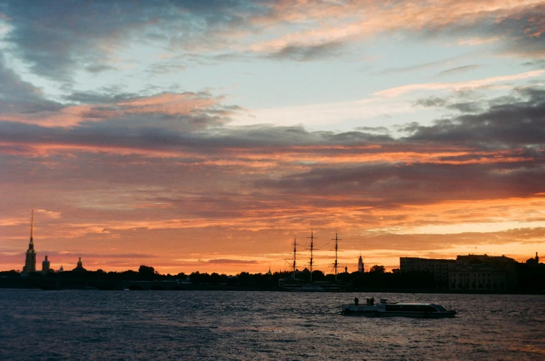 a large body of water with a boat in it, an album cover, pexels contest winner, romanticism, city sunset, three masts, olafur eliasson, saint petersburg