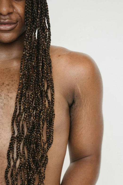 a man with dreadlocks posing for a picture, an album cover, by Jessie Alexandra Dick, trending on pexels, hyperrealism, sparse chest hair, woman with freckles, ( ( brown skin ) ), partially male hairy torso