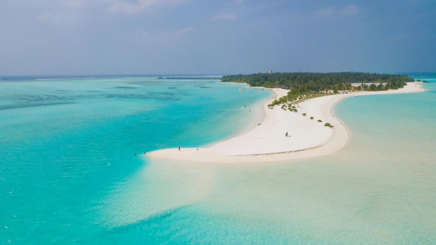 an island in the middle of the ocean, pexels contest winner, hurufiyya, white sandy beach, cosmopolitan, light blue water, slim aarons