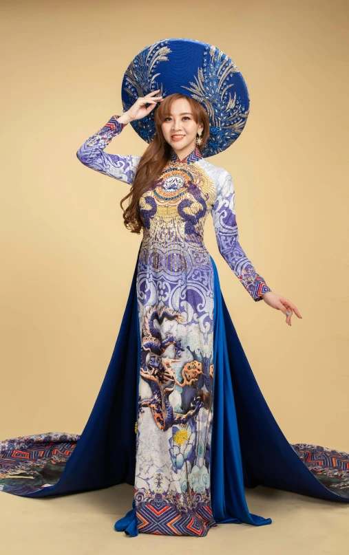 a woman wearing a long dress and a blue hat, an album cover, inspired by Jin Nong, cloisonnism, ao dai, 15081959 21121991 01012000 4k, elaborate costume, full body photograph