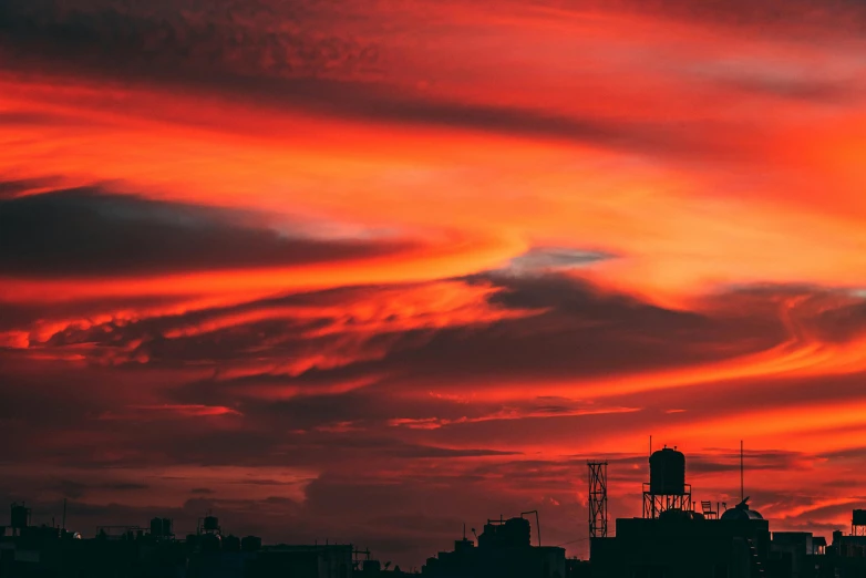 a red sky over a city at sunset, inspired by Elsa Bleda, pexels contest winner, surrealism, mystic hue clouds, vibrant red, instagram photo, ad image