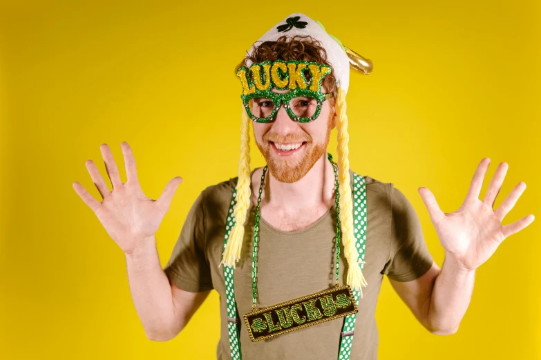 a man that is wearing a hat and glasses, inspired by Bernd Fasching, shutterstock, hurufiyya, irish youtuber, set photo in costume, lachlan bailey, yellow and green