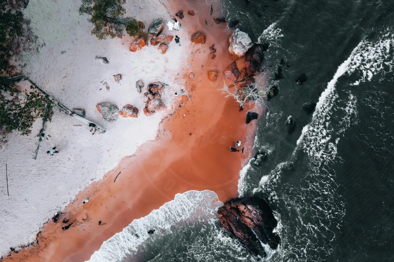 a large body of water next to a sandy beach, by Adam Marczyński, pexels contest winner, orange red black white, air shot, blood in the seahighly, thumbnail