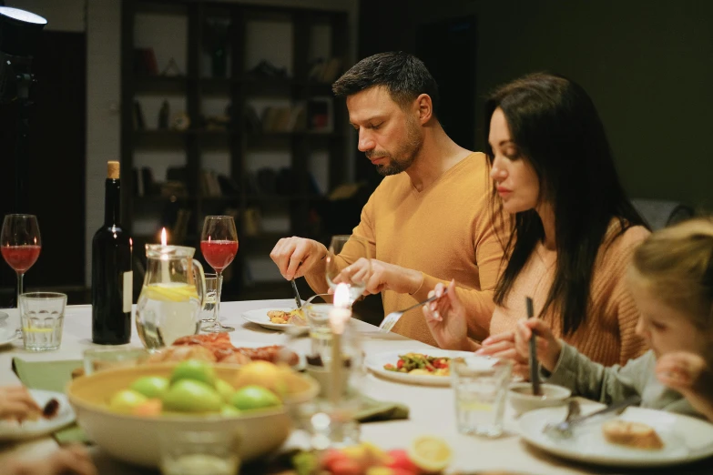 a group of people sitting around a dinner table, profile image, cuisine, 8k 28mm cinematic photo, couple