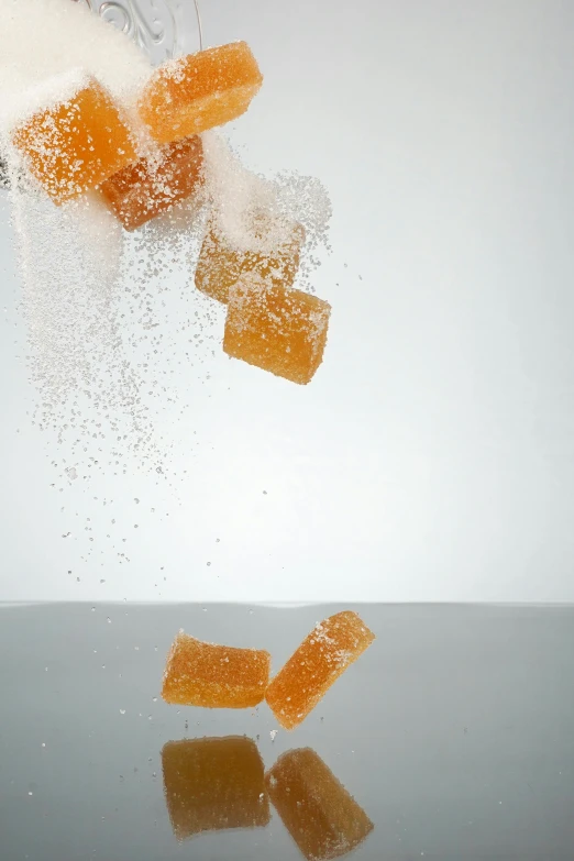sugar cubes falling into a glass of water, by Doug Ohlson, pexels, conceptual art, light orange mist, square, cake, fruit