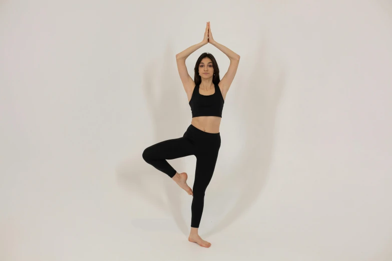 a woman doing a yoga pose against a white background, pexels contest winner, jet black leggins, character is in her natural pose, extremely high quality scan, avatar for website