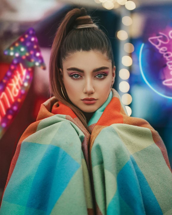 a woman wrapped in a blanket standing in front of a neon sign, a colorized photo, by Mark Arian, trending on pexels, madison beer girl portrait, rainbow eyes, wearing a fancy jacket, alexey gurylev