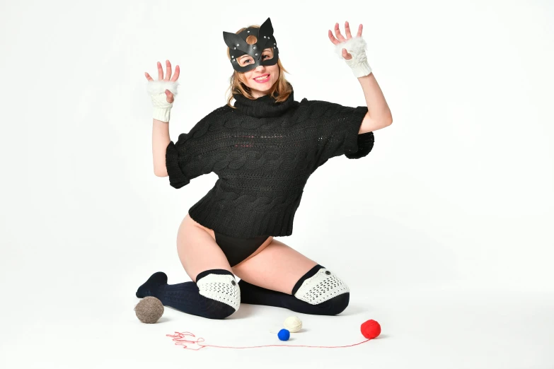 a woman sitting on the ground with a cat mask on, an album cover, furry art, wearing kneesocks, studio shoot, 15081959 21121991 01012000 4k, sweater