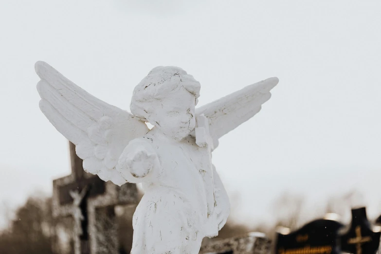 a statue of an angel in a cemetery, a statue, pexels contest winner, white marble, 15081959 21121991 01012000 4k, cupid, made out of shiny white metal