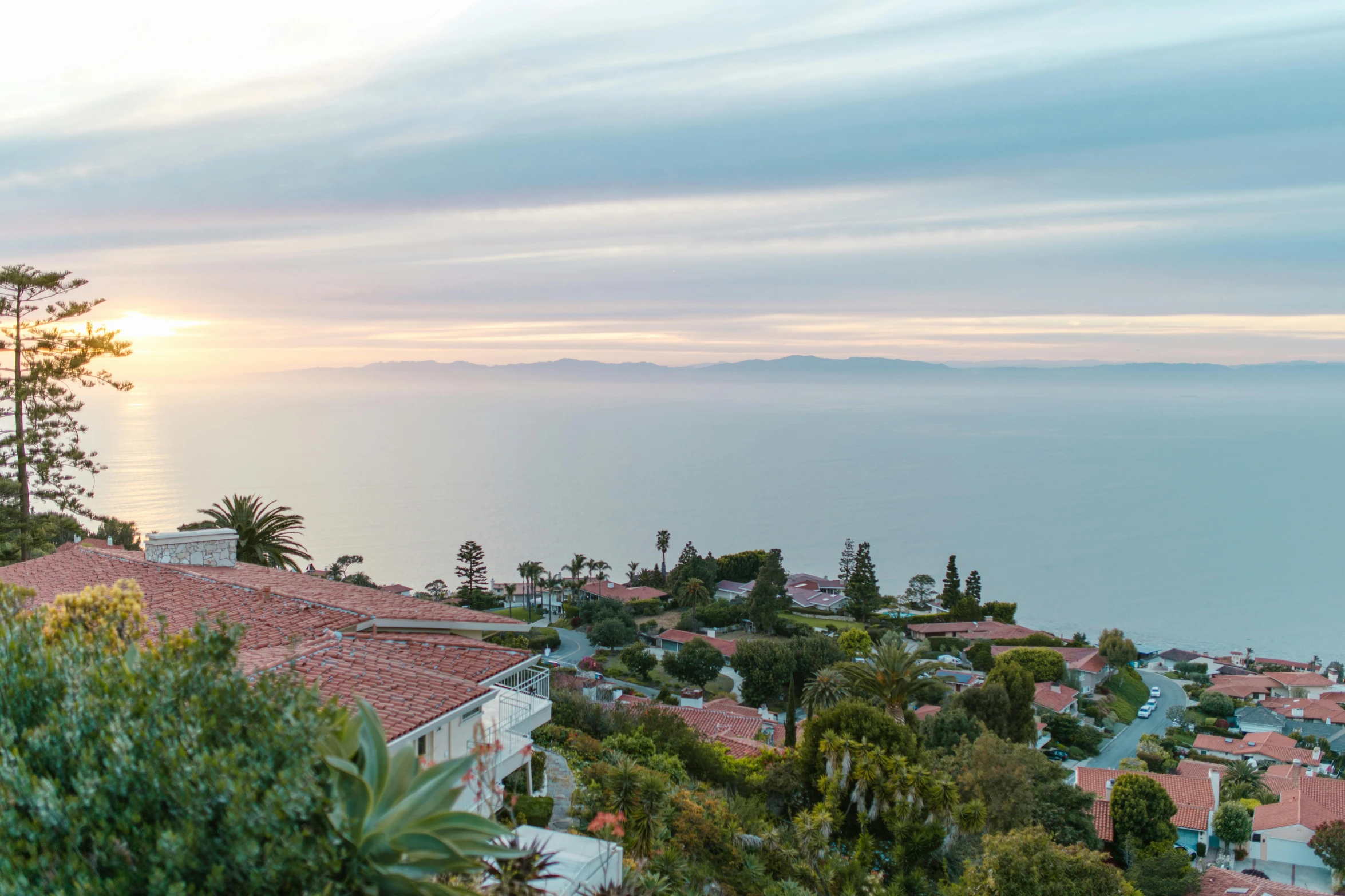 a view of the ocean from the top of a hill, renaissance, shot from roofline, carson ellis, during dawn, lush vista