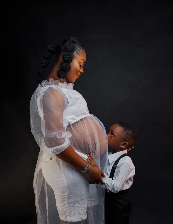 a pregnant woman holding a small boy's hand, an album cover, by Chinwe Chukwuogo-Roy, pexels contest winner, profile pose, open belly, gif, little brother