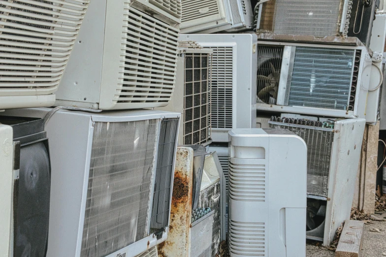 a bunch of air conditioners stacked on top of each other, an album cover, unsplash, renaissance, scrap metal, junk tv, ignant, australian