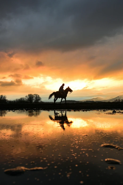 a person riding a horse across a body of water, during sunset, 4k hd award winning photograph, magical stormy reflections, 2019 trending photo