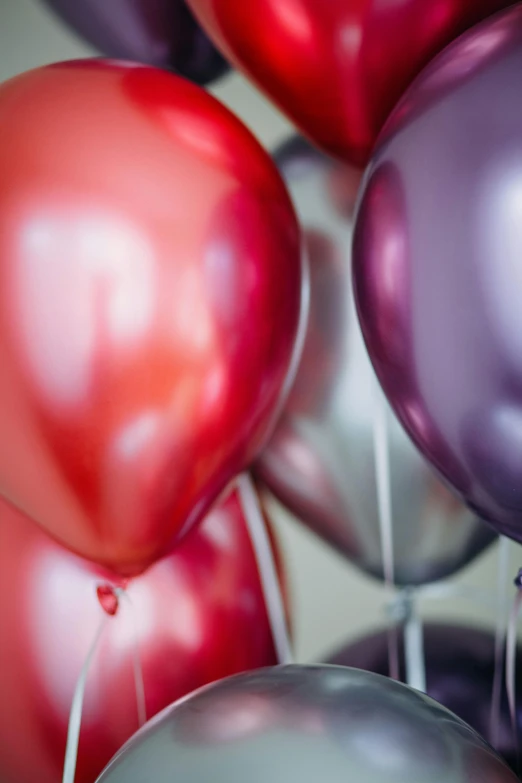 a close up of a bunch of balloons, purple and scarlet colours, silver lining, smooth matte, aged 13