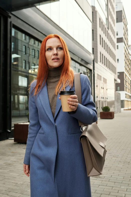 a woman in a blue coat holding a cup of coffee, walking to work, wild ginger hair, wearing a worn out suit, muted colors. ue 5