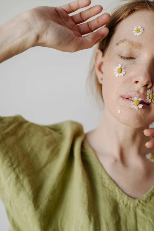 a woman with flowers all over her face, trending on pexels, chamomile, full view of face and body, pleasing, minimalist