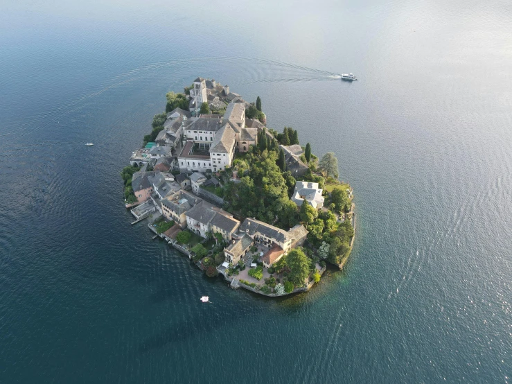 a small island in the middle of the ocean, by Carlo Martini, pexels contest winner, renaissance, lakeside, biennale, press shot, where a large