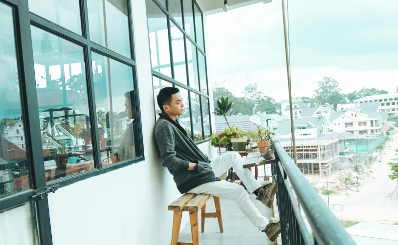 a man sitting on a chair on a balcony, inspired by Ni Yuanlu, pexels contest winner, handsome chad chin, peaceful day, hoang long ly, profile image