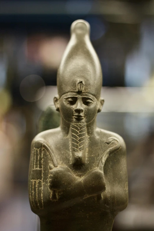 a close up of a statue of a person, egyptian art, ankh symbol around the neck, at a museum, awards winning, small stature