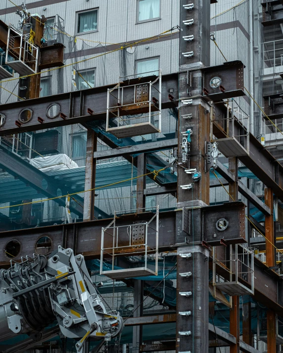 a very tall building with a lot of windows, pexels contest winner, constructivism, inside iron and machines, robot in construction, 2022 photograph, shipyard