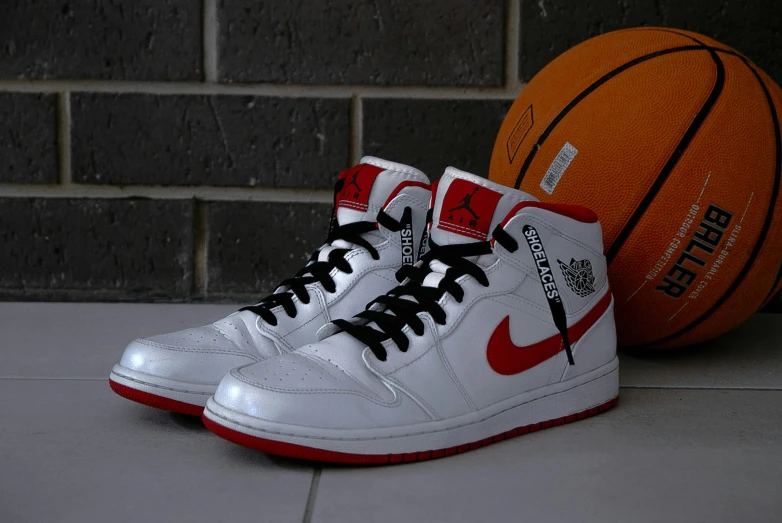 a pair of white and red shoes next to a basketball, 15081959 21121991 01012000 4k, “air jordan 1, mid - shot, taken in the early 2020s
