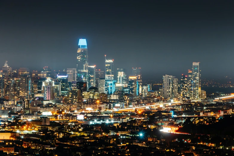 a view of a city at night from the top of a hill, california, complex lights, overlooking a modern city, landscape photo