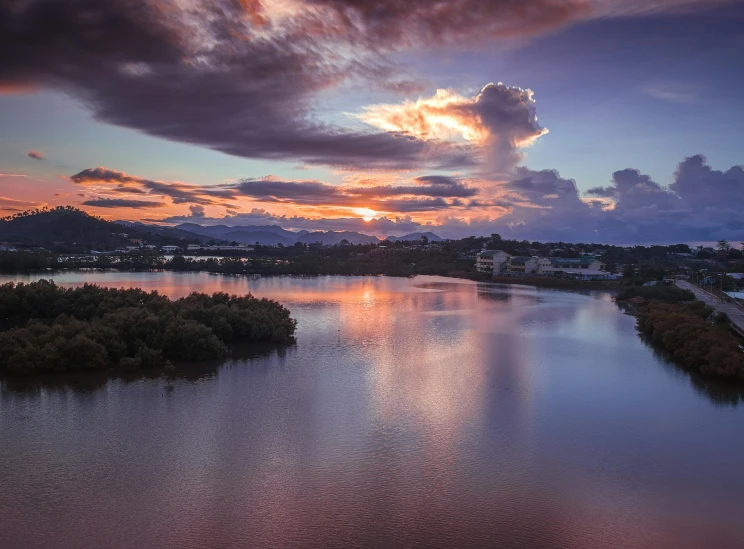 a large body of water under a cloudy sky, a picture, by Lee Loughridge, unsplash contest winner, renaissance, sunset panorama, lagoon, gold coast australia, pink and grey clouds