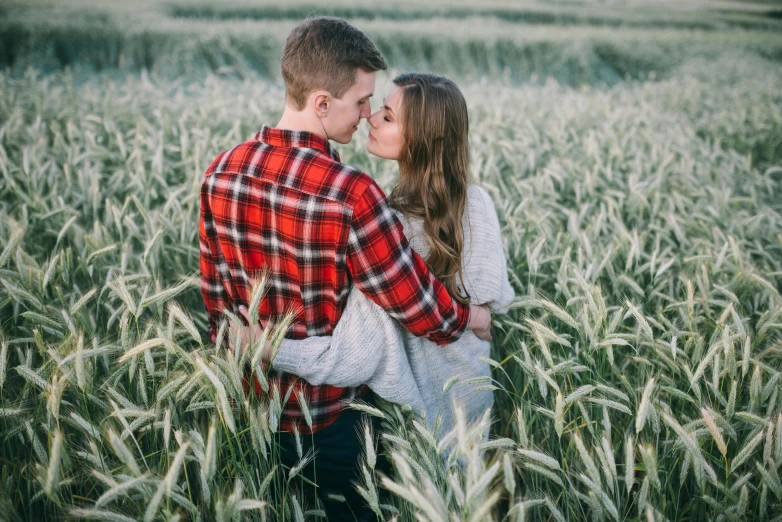 a couple standing in a field of tall grass, pexels contest winner, handsome girl, owen klatte, farming, avatar image