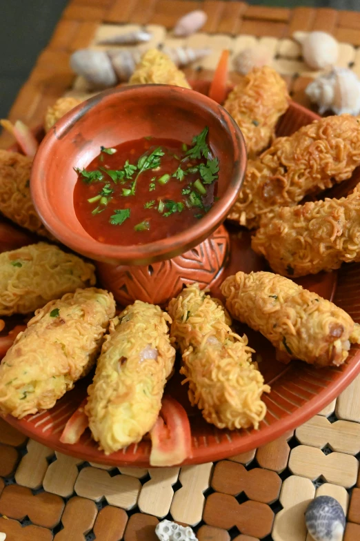 a close up of a plate of food on a table, hurufiyya, rockets, gnarled fingers, deep fried, spanish