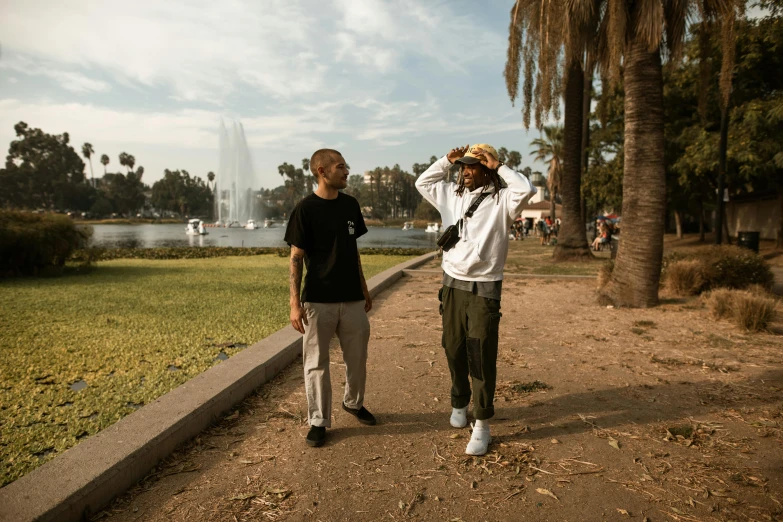 two men standing next to each other in a park, unsplash, visual art, california;, crips, behind the scenes photo, avatar image