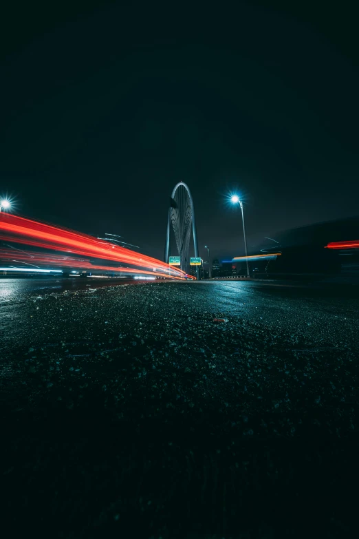 a long exposure photograph of a bridge at night, london streets in background, massive arch, unsplash 4k, motion photo