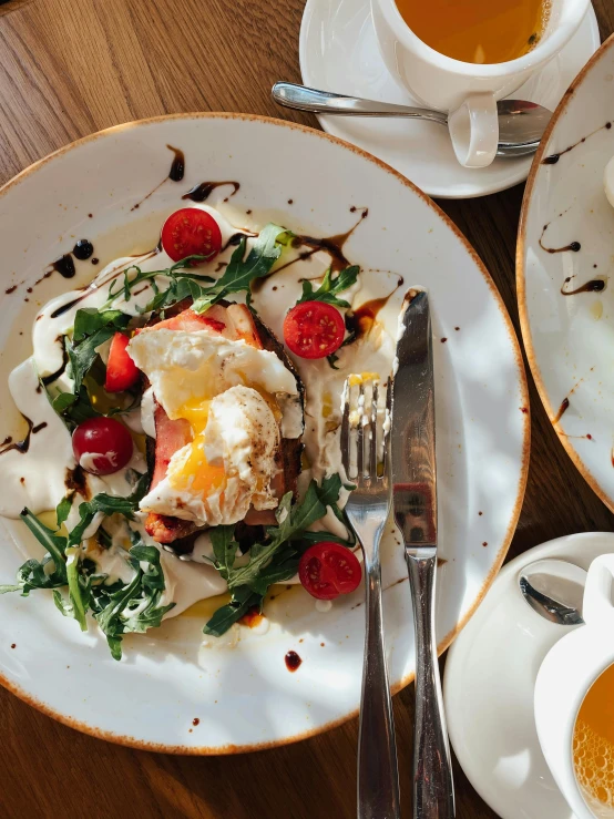 a table topped with plates of food and cups of coffee, eggs, profile image, salad, iconic